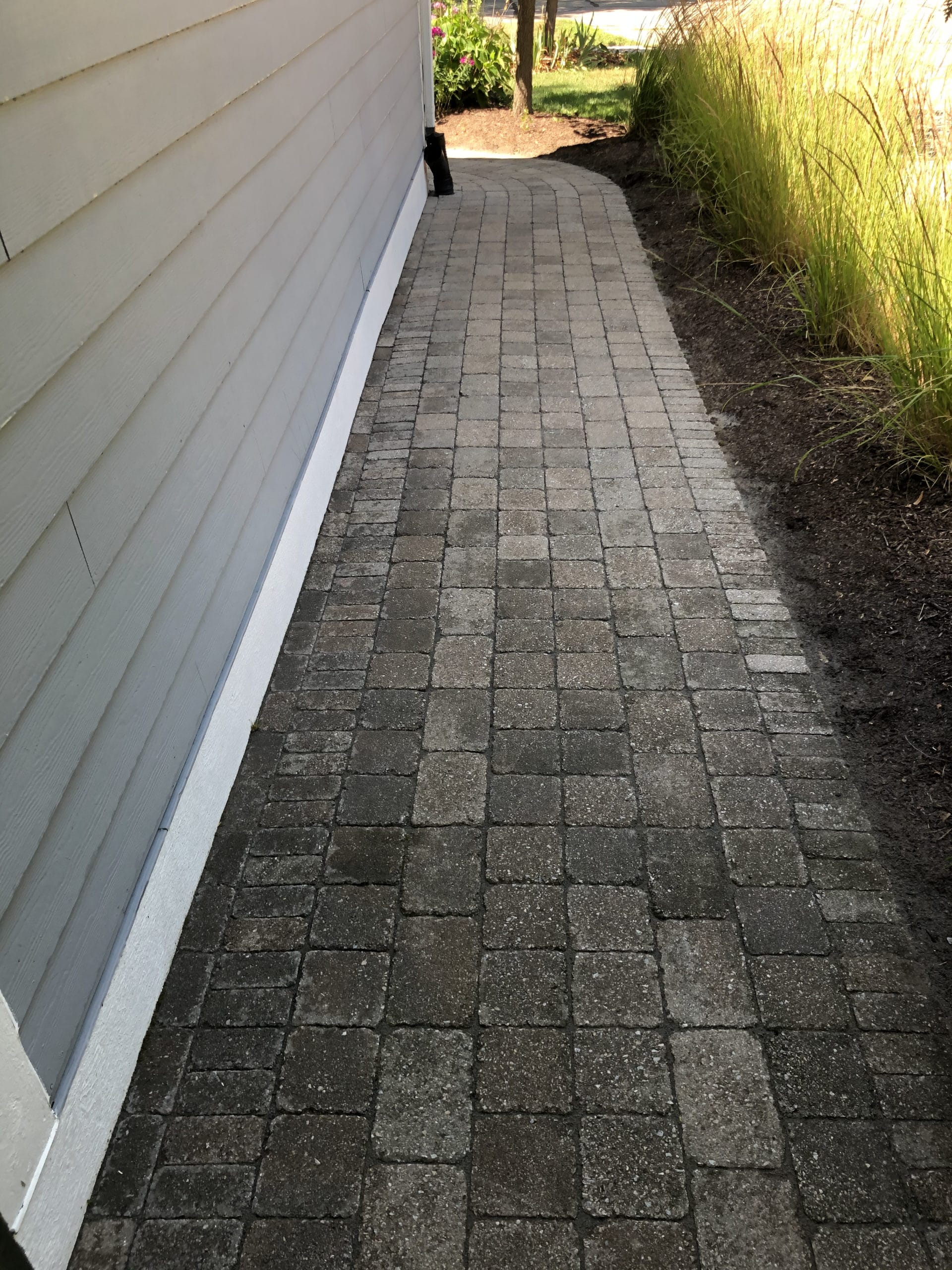 Image of paver brick sidewalk power washed by J & J Landscaping, LLC in Metro Detroit, Michigan