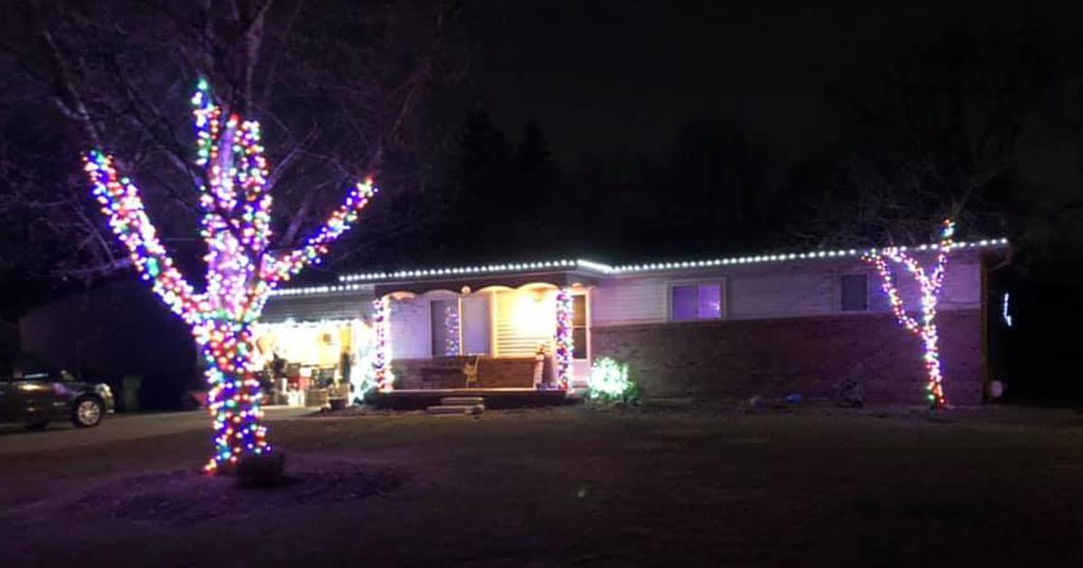 A residential property in Metro Detroit decorated with Christmas lights by J & J Landscaping