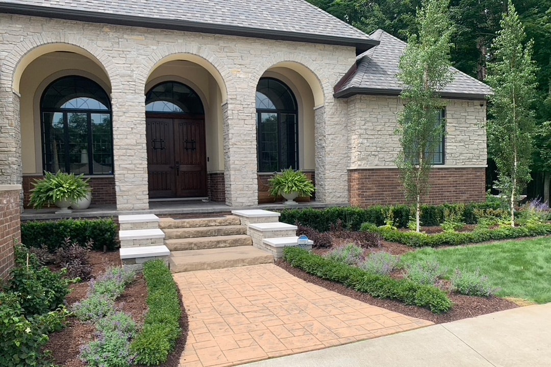 A beautiful new residential landscape and hardscape designed and built by J & J Landscaping in Lake Orion, Michigan