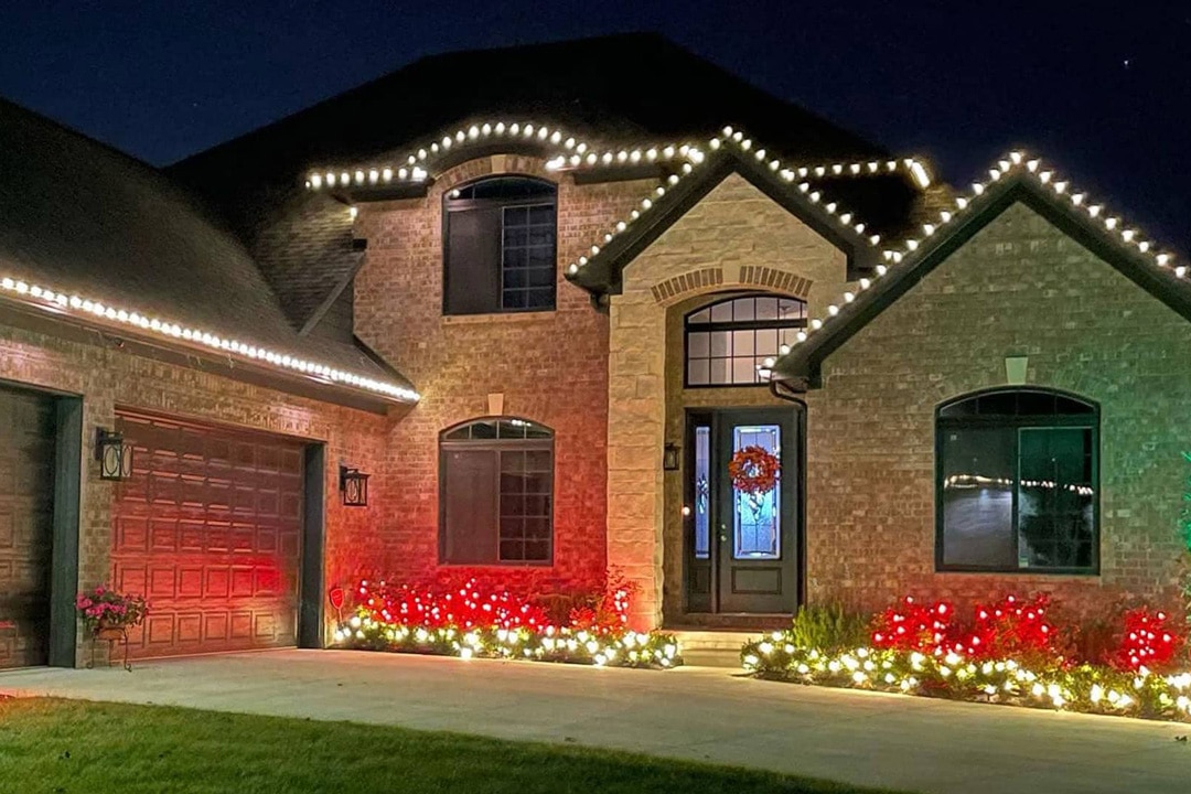 A Metro Detroit residential property with professionally installed Christmas lights by J & J Landscaping