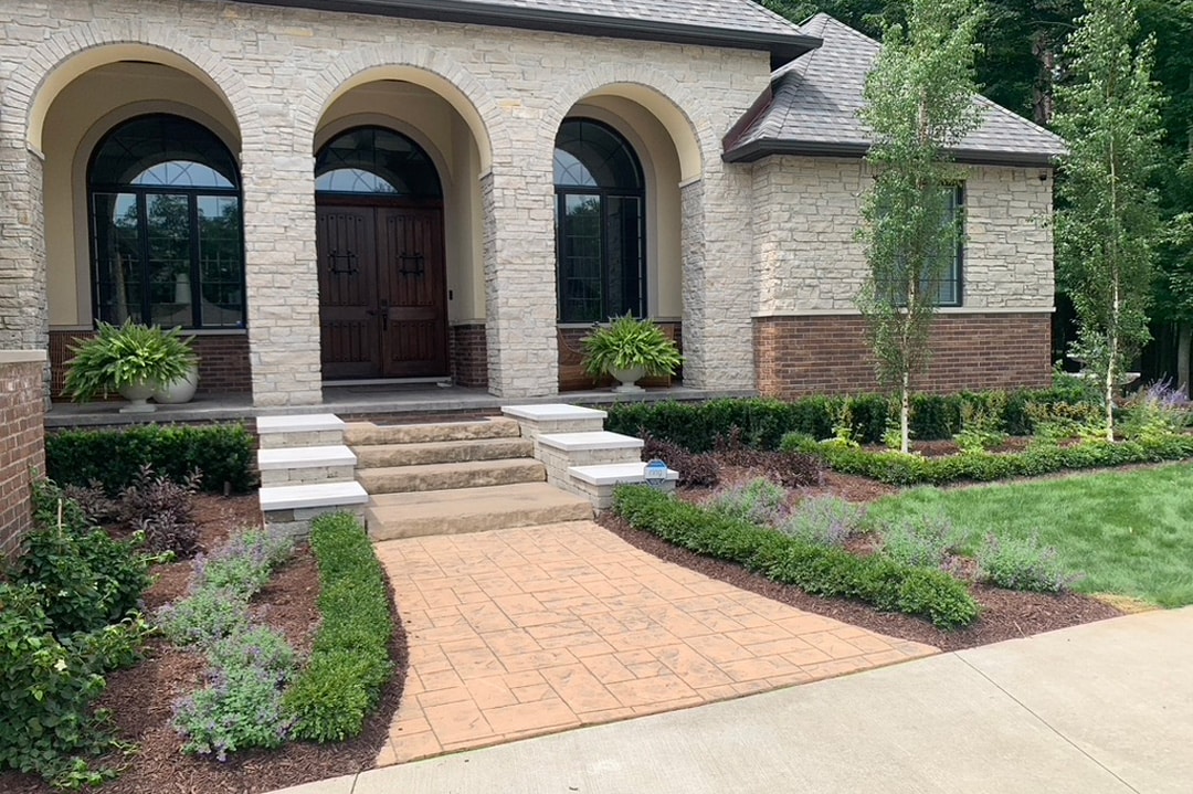 A beautiful new residential landscape and hardscape designed and built by J & J Landscaping in Lake Orion, Michigan