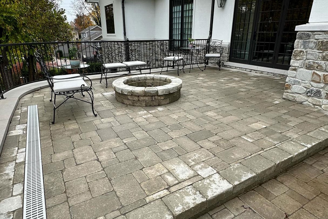 A residential brick paver patio by J & J Landscaping in Metro Detroit