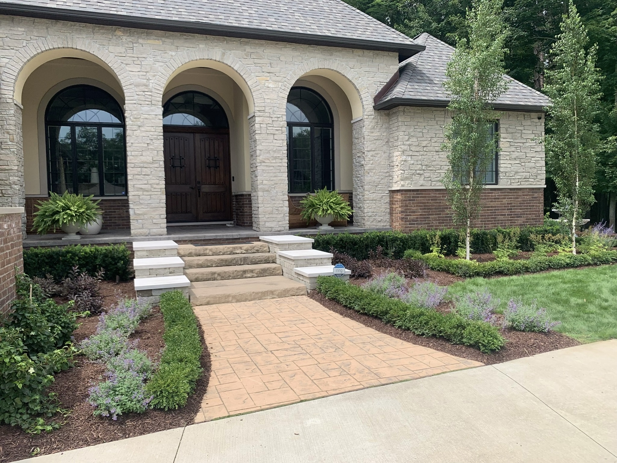 A beautiful new residential landscape and hardscape designed and built by J & J Landscaping in Lake Orion, Michigan